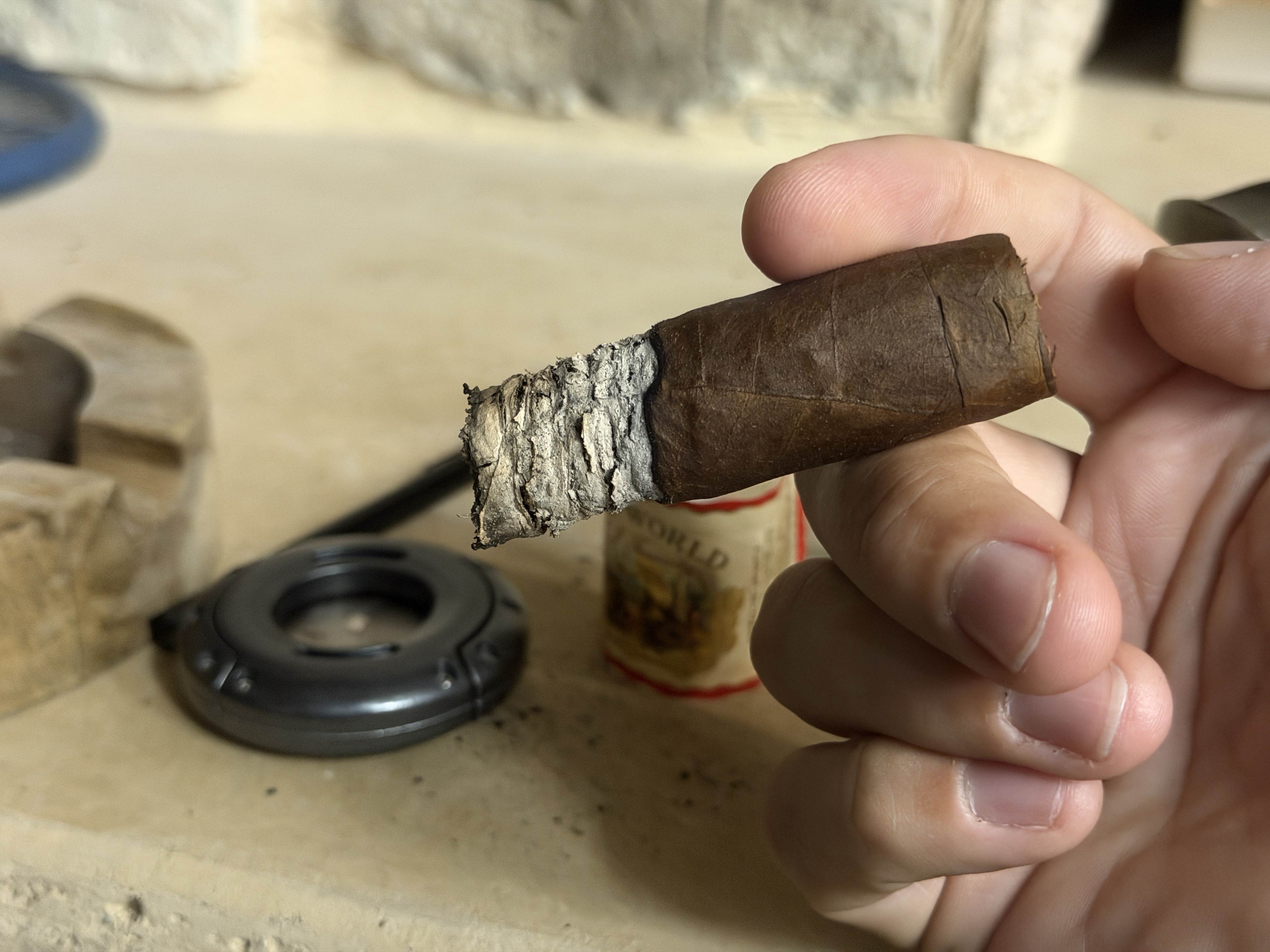 Band-off New World Gobernador Toro in the final third with stacked gray ash on the foot