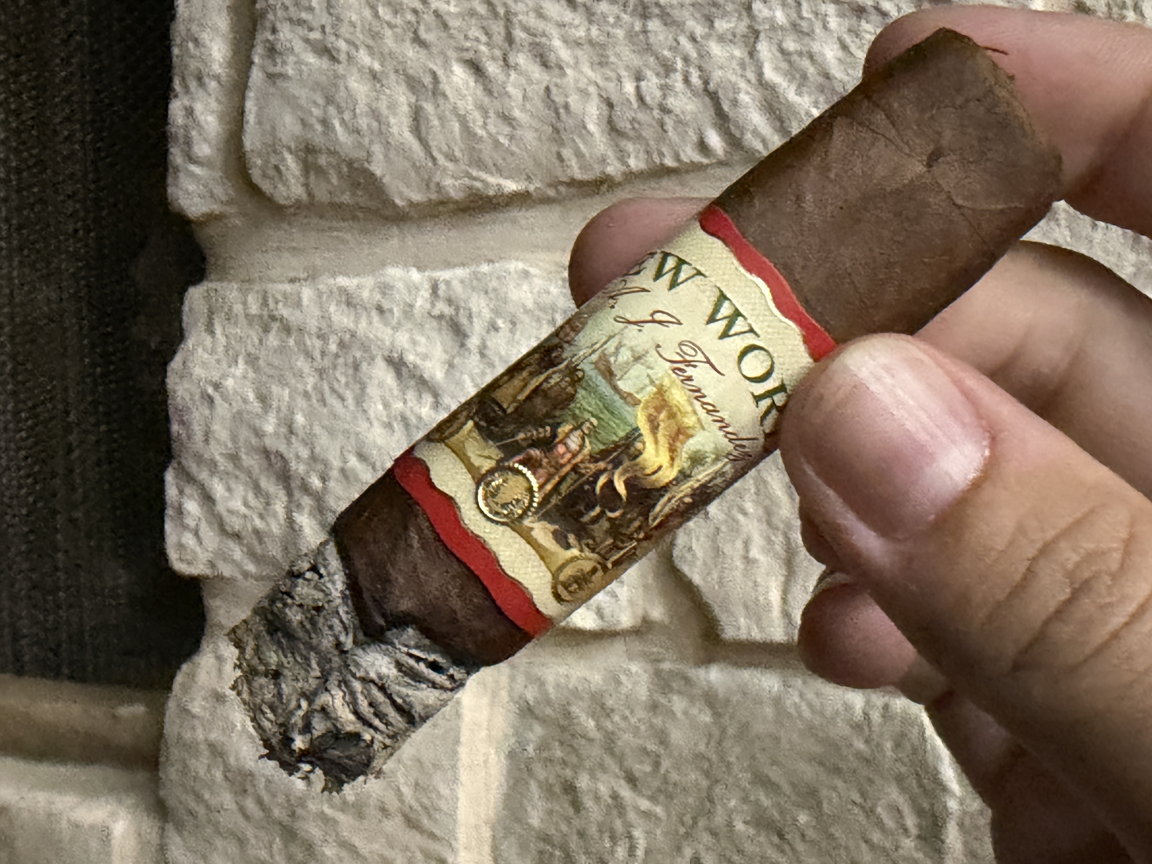 New World Gobernador Toro burned down close to the band with a long craggy ash still attached