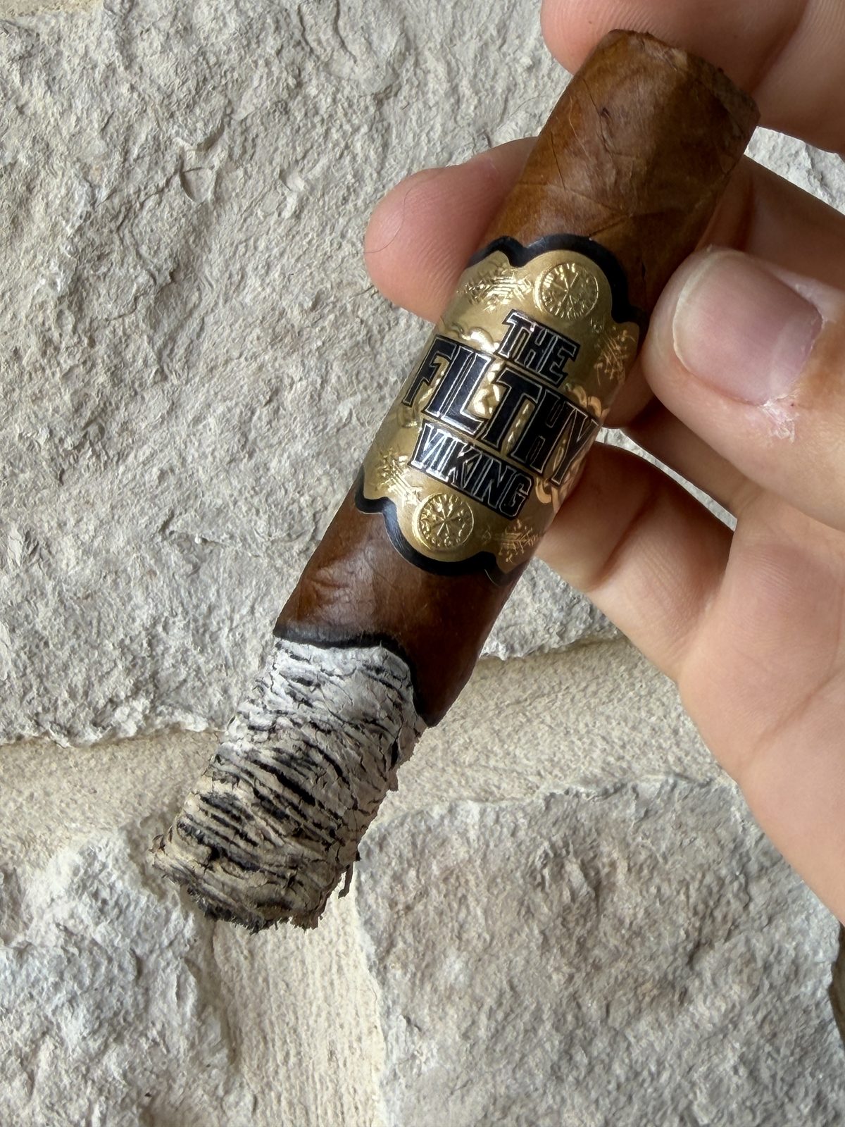 The Filthy Viking Toro at the end of the second third, tall ash stack with dime ridges on one side going flaky on the other and a wavy burn line