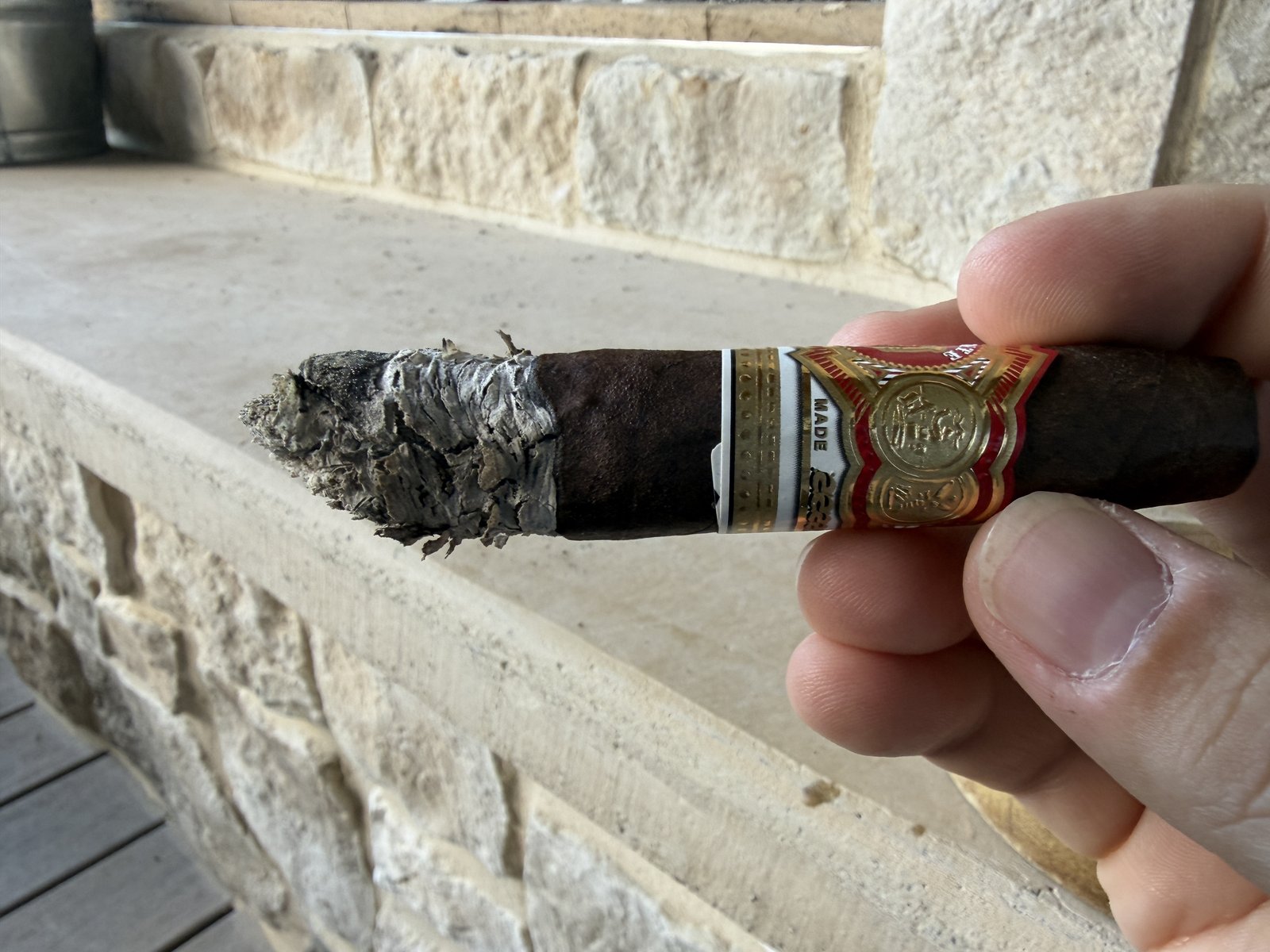 Flaky-looking gray ash stacked on the Añejo Shark near the end of the second third