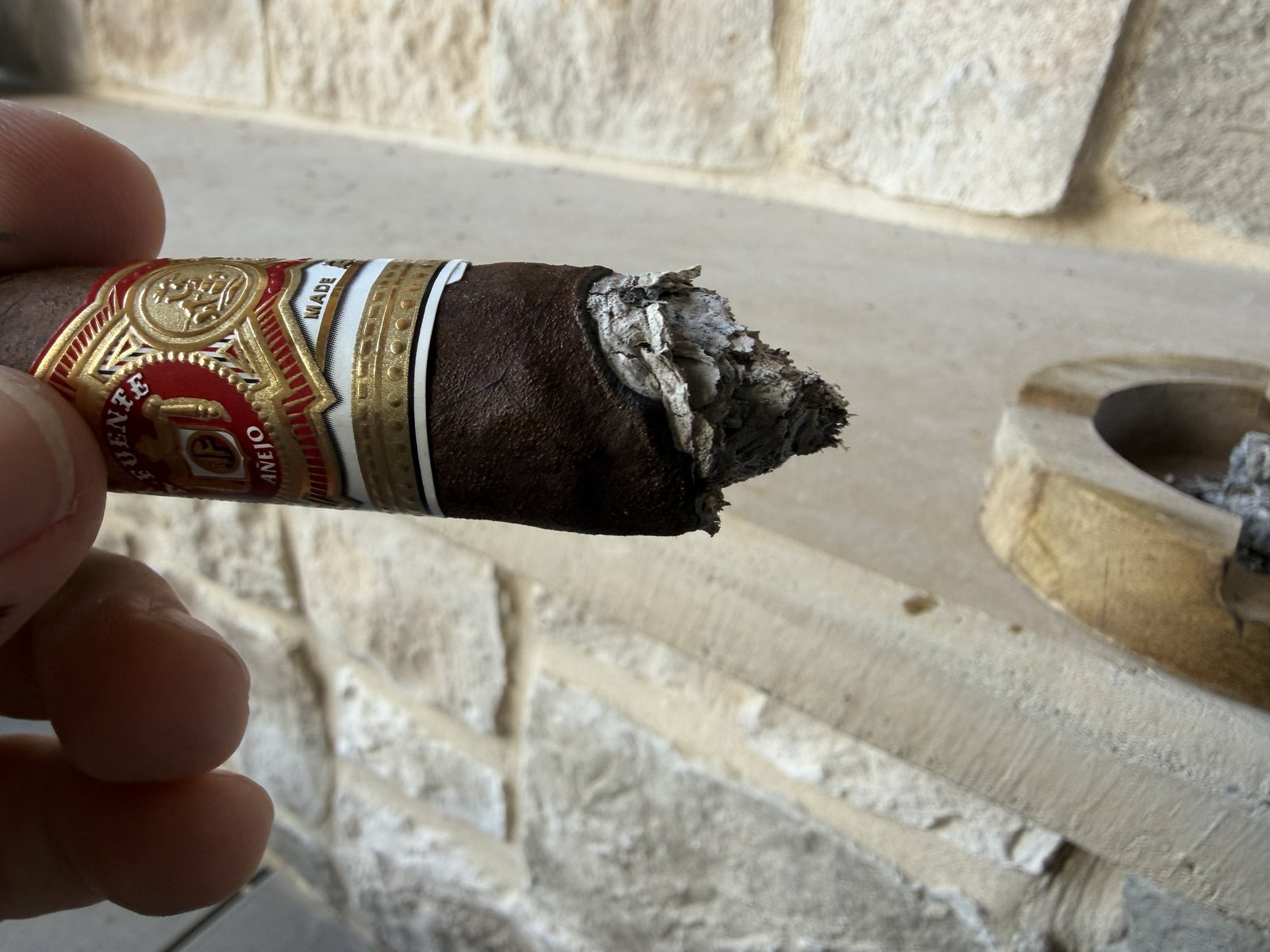 Añejo Shark burning slightly crooked near the band before a touch-up