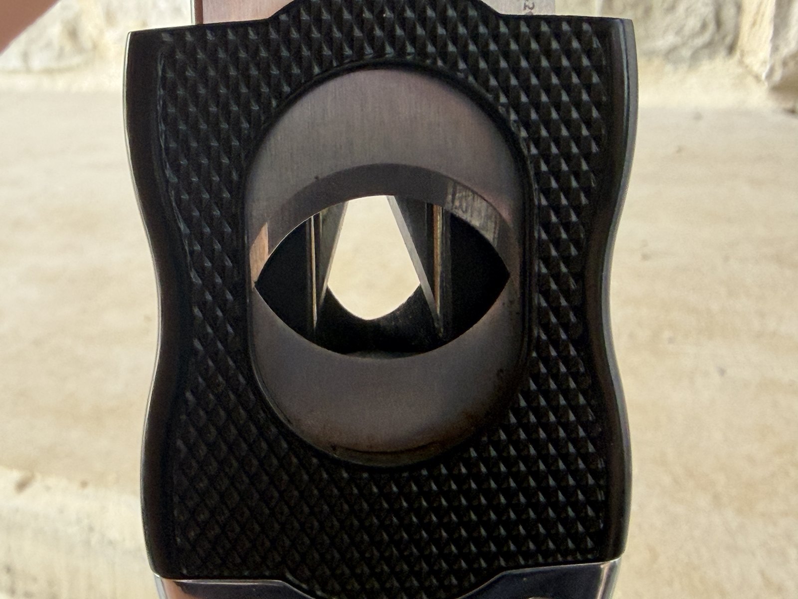 Backlit close-up through the straight-cut opening of the Colibri SV-Cut showing both blade assemblies inside
