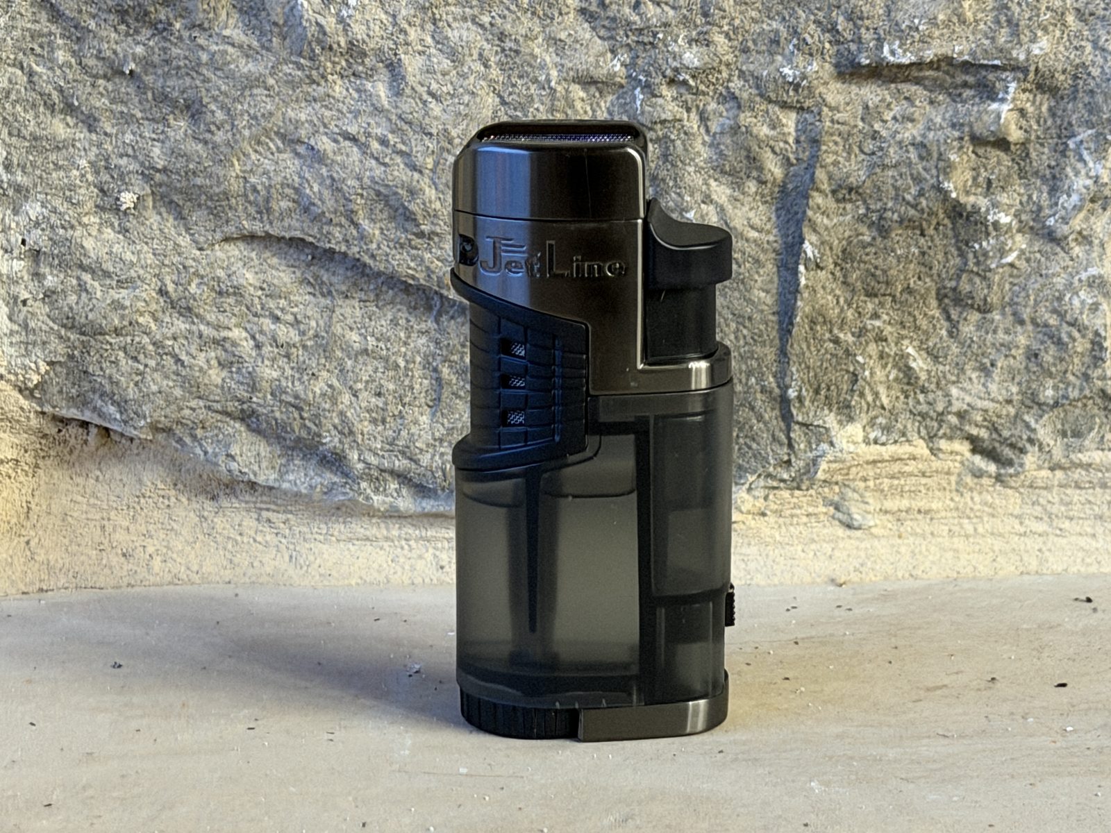 Jetline Mr. Fatboy quad torch table lighter standing upright, smoked translucent fuel tank and large curved lid