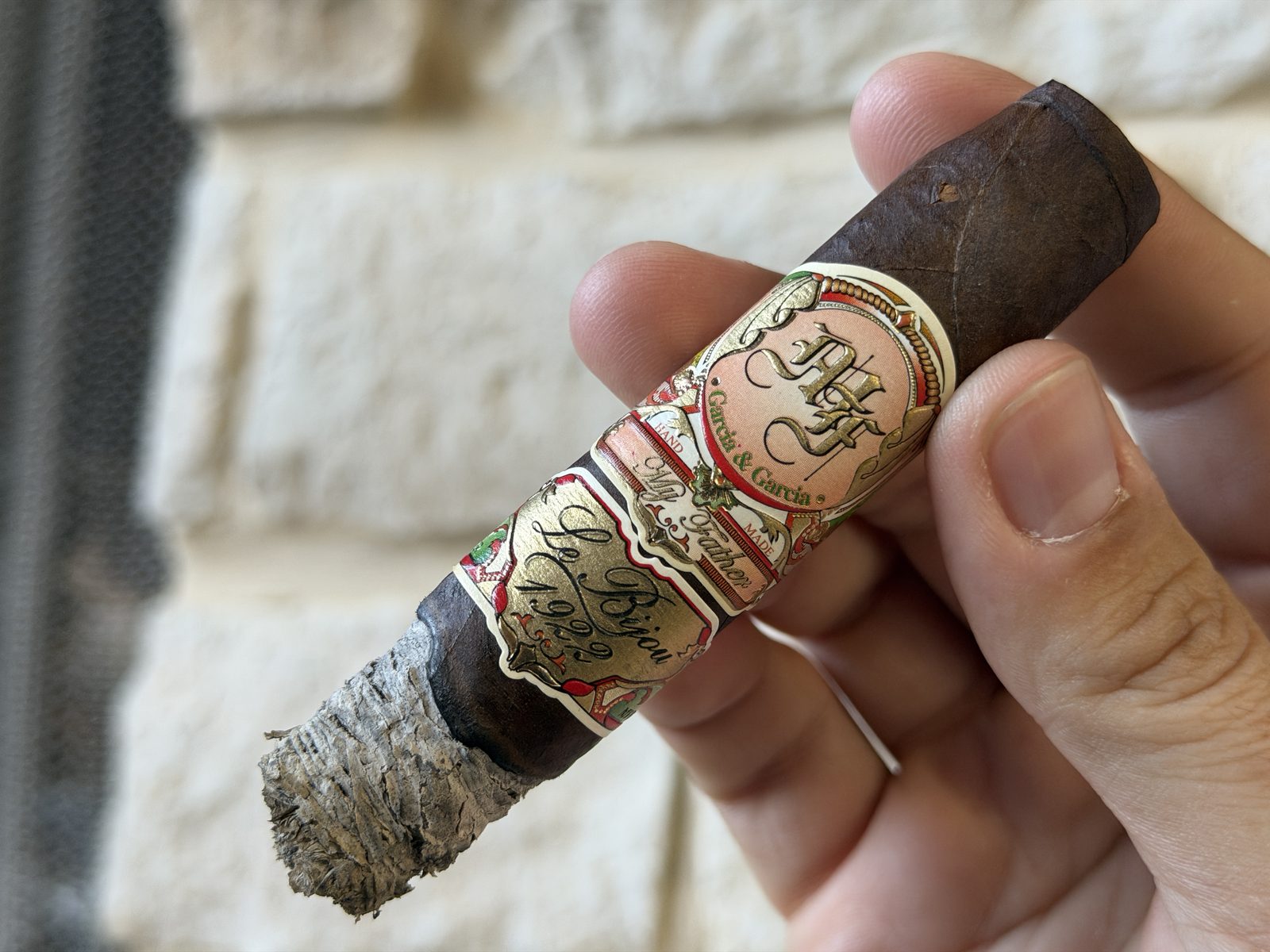 Le Bijou 1922 Torpedo mid-smoke held in hand, pale dime-stacked ash with a flaky backside